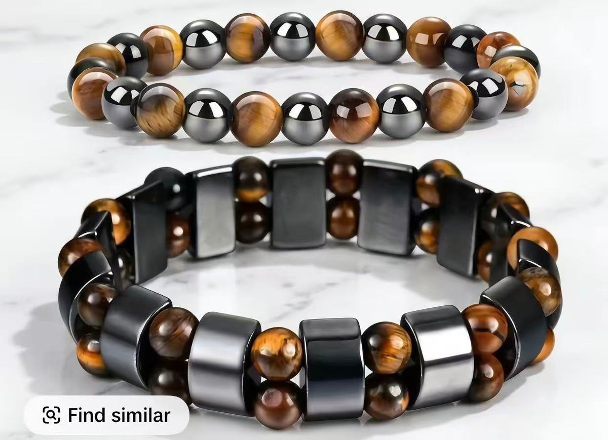 Green Aventurine and Tiger Eye money bracelet arranged in circle on dark wood